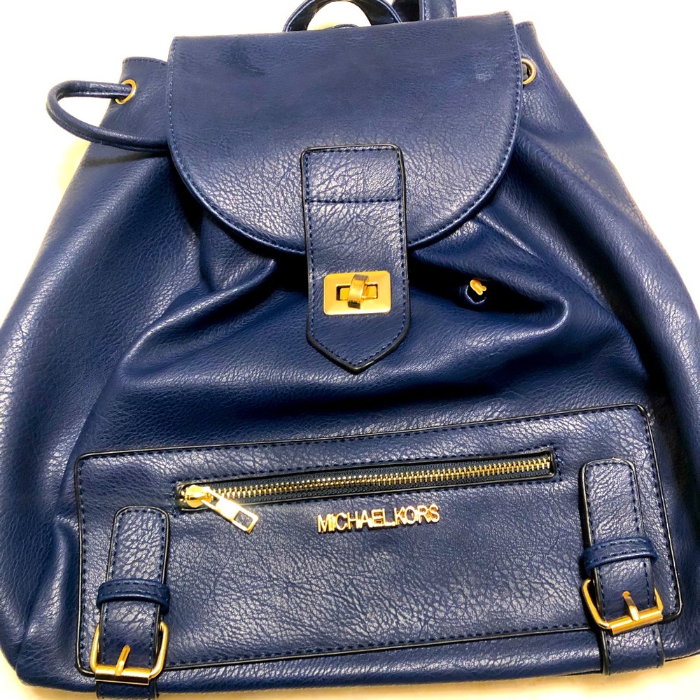 Like New! Beautiful and classy  dark blue Michael Kors backpack/purse